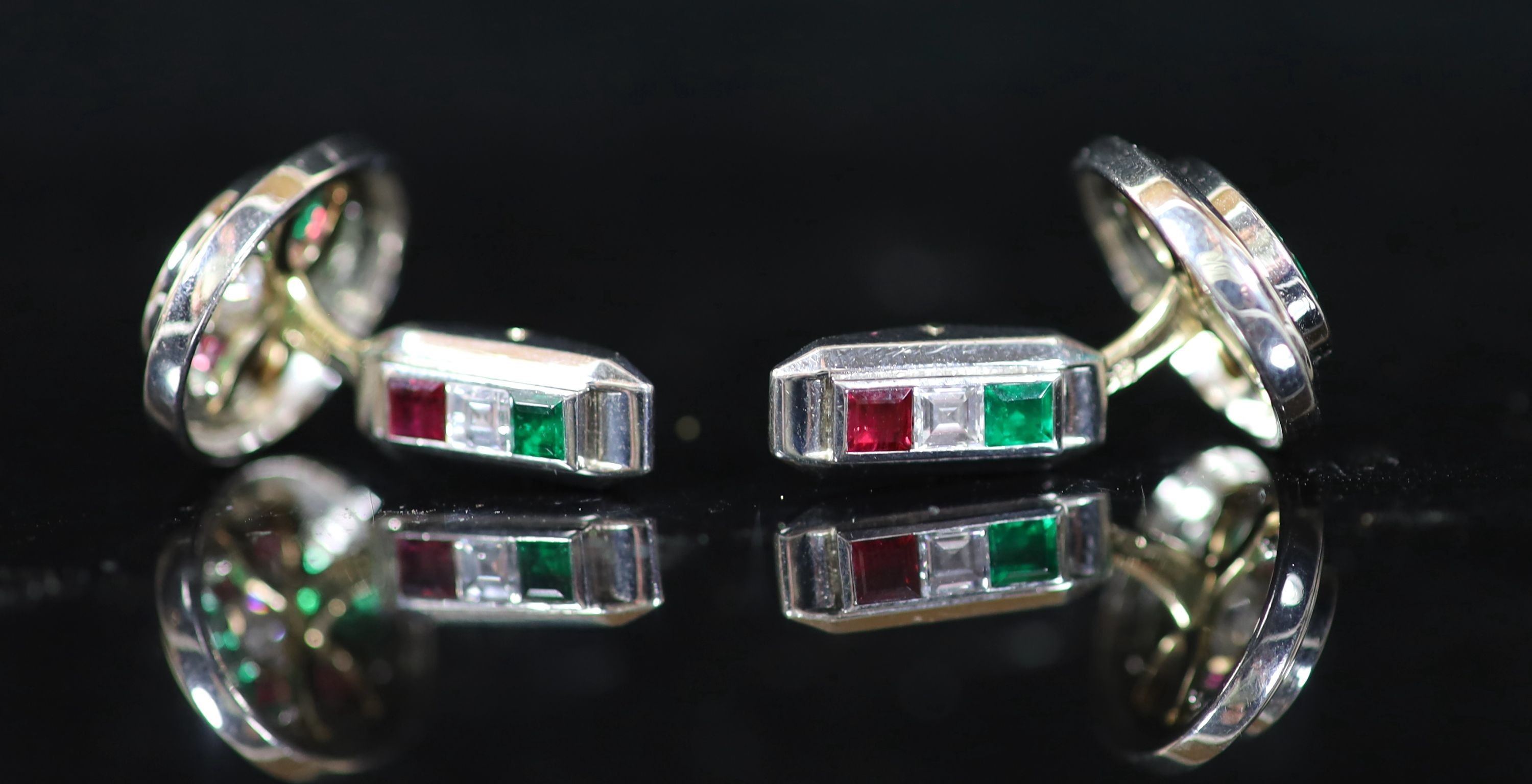 A pair of modern Asprey 18ct gold and platinum, ruby, emerald and diamond oval cufflinks